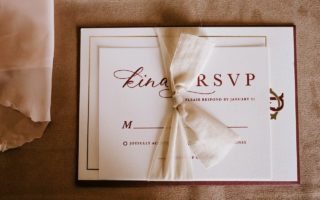 Invitation card with the inscription tied with ribbon