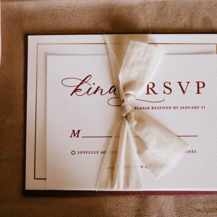 Invitation card with the inscription tied with ribbon