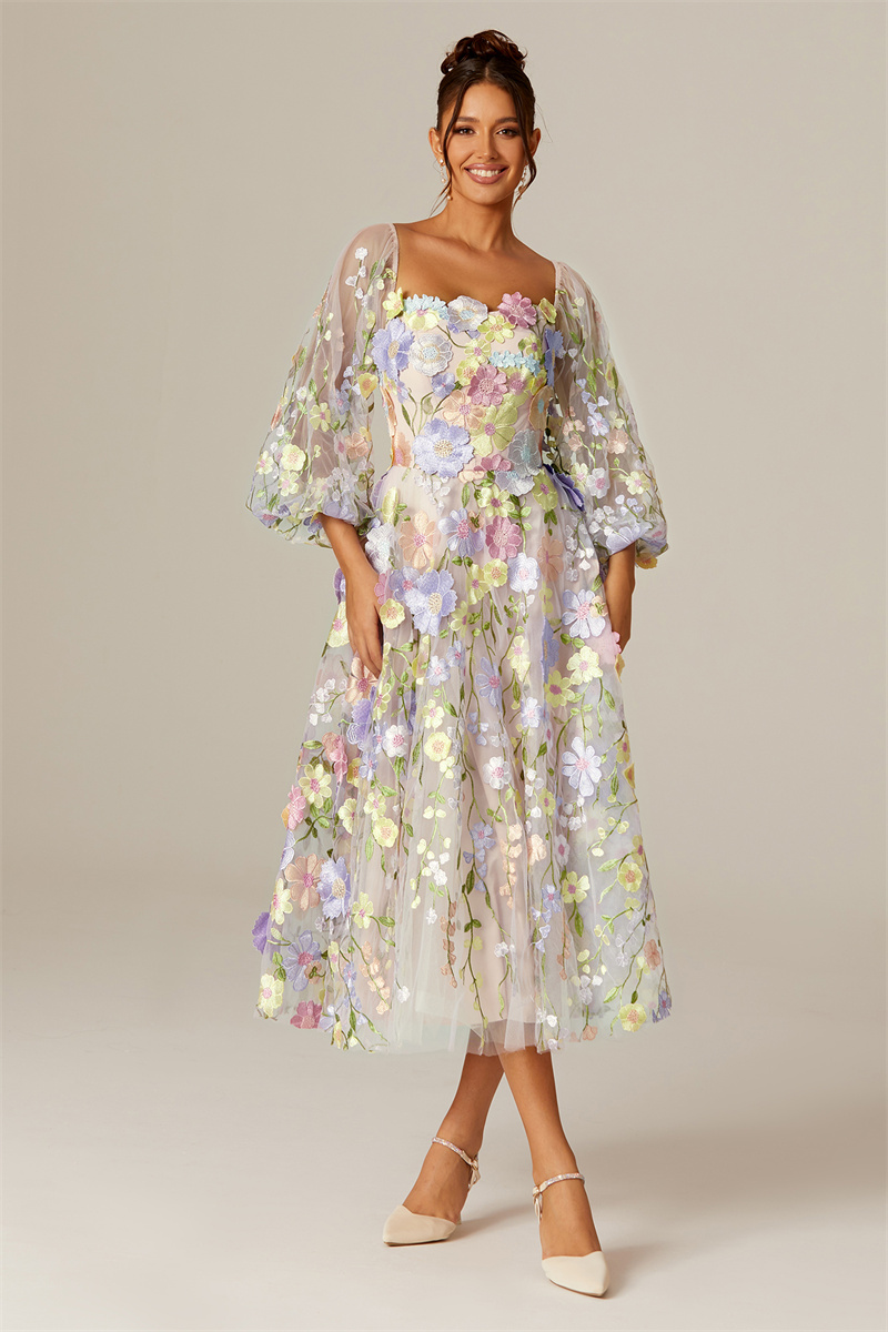 The model wears an AW floral theme bridesmaid dress, giving a warm smile.