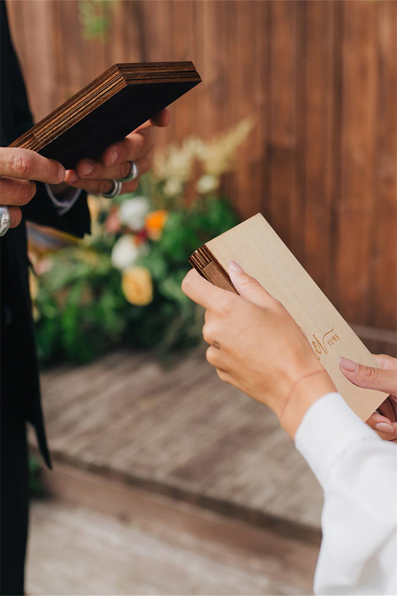 : Two rustic-style wedding vow books with exquisite covers.