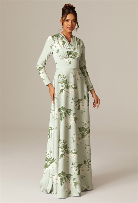 Woman in a sage green floral dress with long sleeves and a V-neckline.