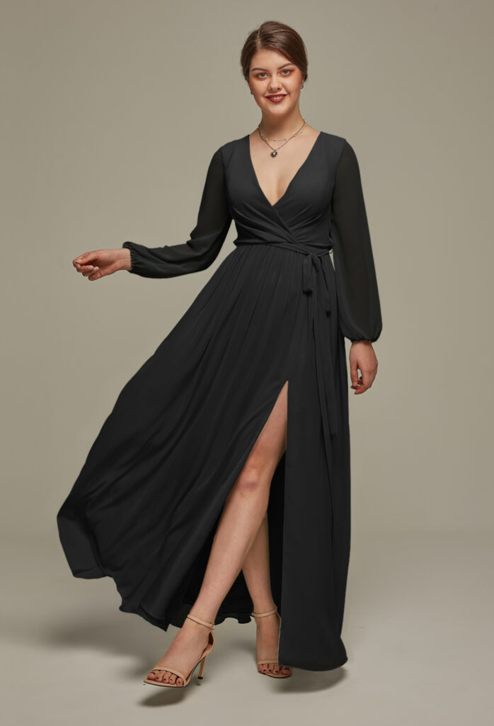 Woman in a long-sleeve, black bridesmaid dress with a slit.