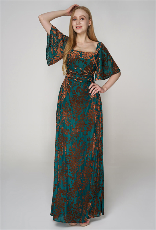 Velvet gown adorned with copper floral patterns and elegant flutter sleeves.